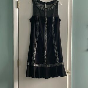 Pretty black and silver cocktail dress. Never worn but no tags